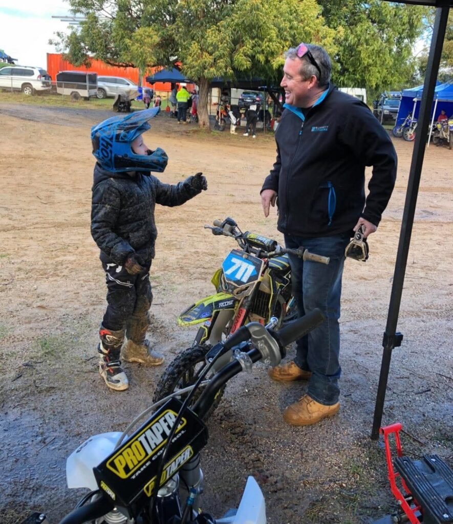 Evan Foley with his dad Wayne at the bike, race number 711